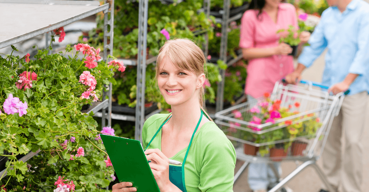 Retail - lady in garden centre with clip board